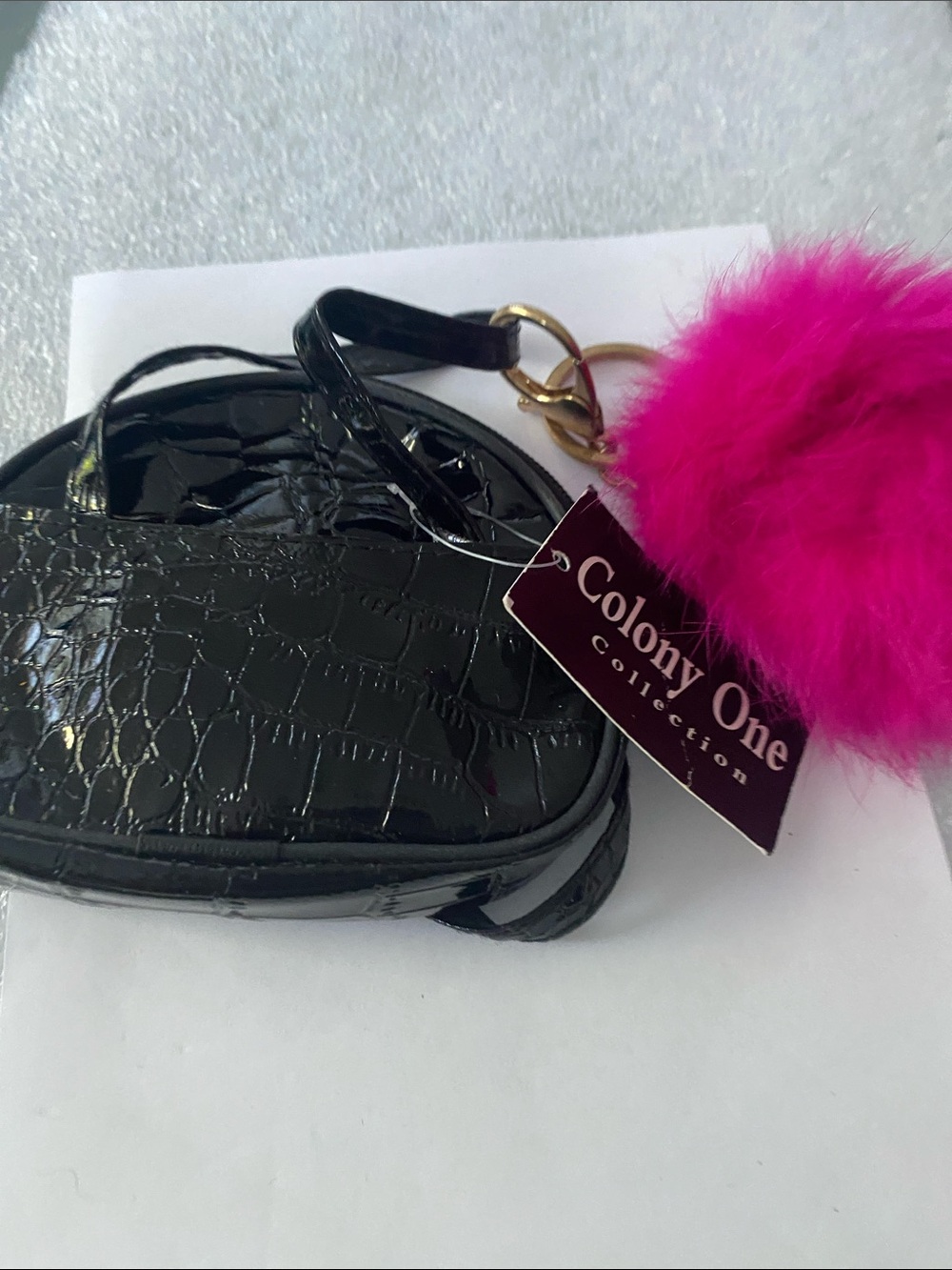 Black Croc-Embossed Wristlet with Pink Pom Pom